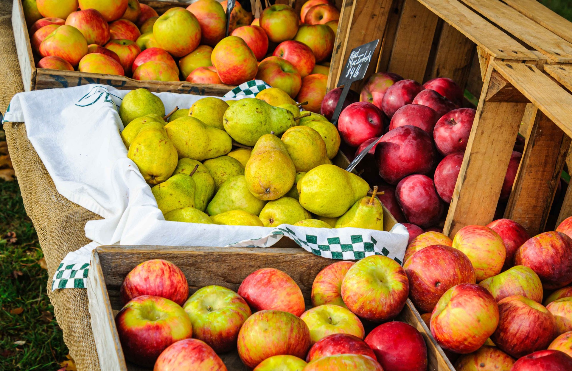 Crates of Apples and Yellow Pears